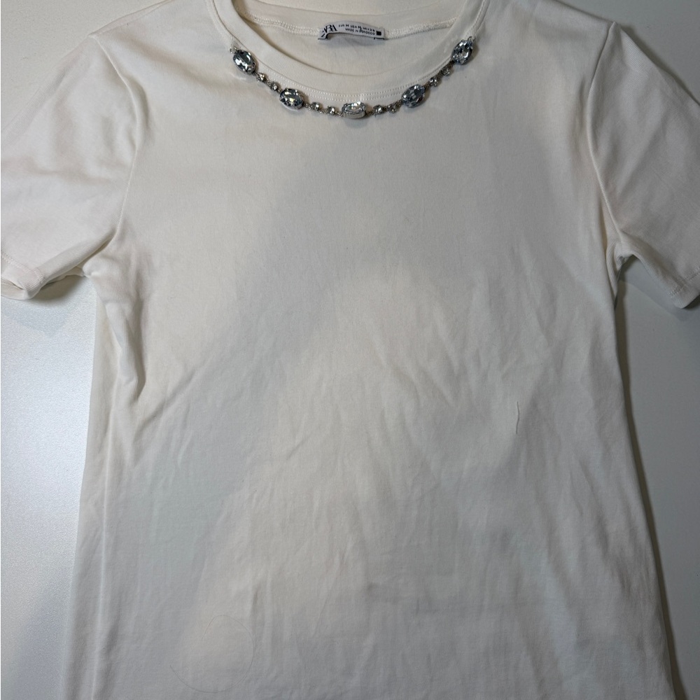 Elegant Cream Top with Silver Accents
